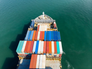 Cargo container ship carrying container export  goods running around  port concept freight shipping...