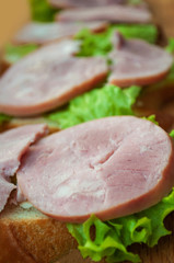 
Sandwich with ham and green salad