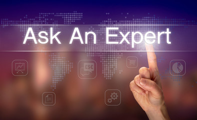 A hand selecting a Ask an Expert business concept on a clear screen with a colorful blurred background.