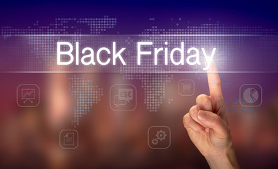 Naklejka premium A hand selecting a Black Friday business concept on a clear screen with a colorful blurred background.