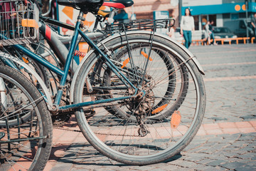 Old bicycles are parked in the city