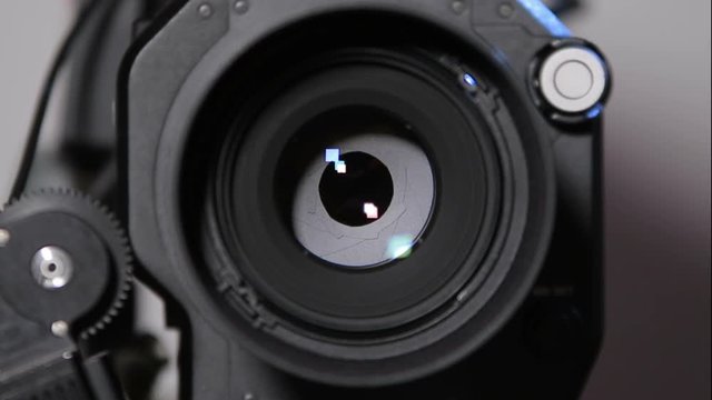 Camcorder front view close-up with 50mm lens and working 8-blades iris (1080p, 25fps)