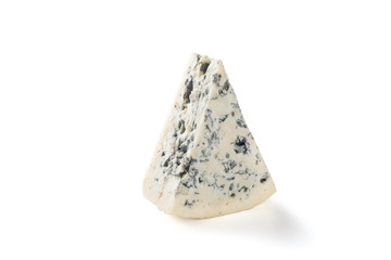 A wedge of full fat soft blue cheese isolated on white.