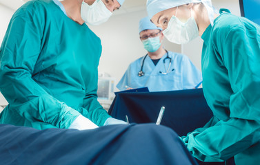 Surgical doctor in full concentration on operation working diligently 