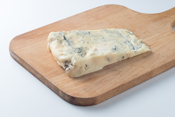 Blue cheese on a wooden serving board