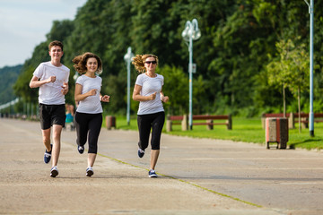 People running in city park