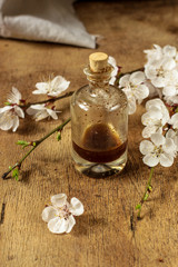 Obraz na płótnie Canvas Vanilla extract in a transparent bottle is a food additive of cuisine. Food background