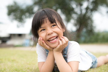 Happy little girl having fun at the park