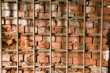 brick wall with the bars in front of it