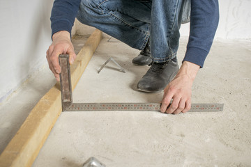 measuring by a square during installation during the repair of an apartment
