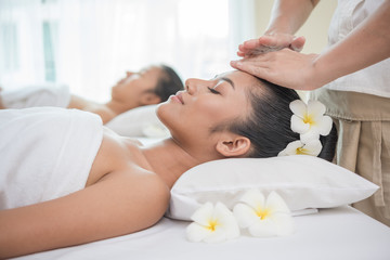 Obraz na płótnie Canvas young woman getting spa treatment at beauty salon. spa face massage. facial beauty treatment. spa salon.