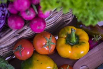 group of mixed vegetable ready for salades. colors and background for a natural raw food ready to been cooked at home for a healhty lunch or dinner