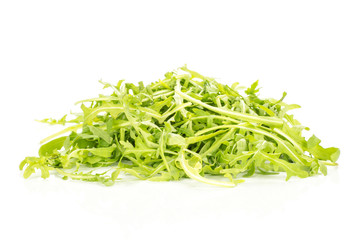 Fresh arugula leaves heap isolated on white background.