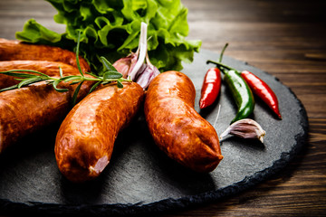 Raw sausages with and vegetables