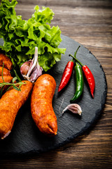 Raw sausages with and vegetables