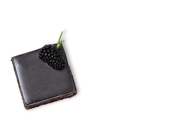chocolate cake with blackberries on white background