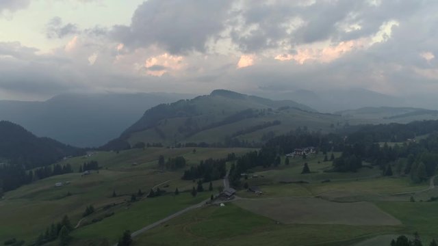 Aerial Drone video of the Schlern Massiccio dello Sciliar mountains on the Italian Alps Dolomites with birds flying on the foreground