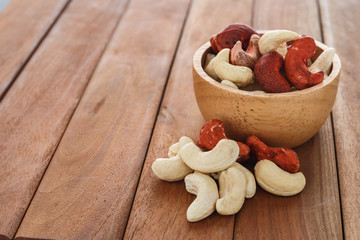 Cashew nuts on a  wooden floor