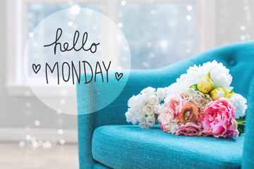Hello Monday message with flower bouquets with turquoise chair © Tierney
