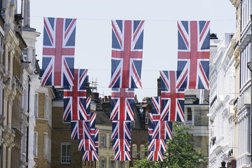 Union Jack flags hang in Central London in preperation for the royal wedding
