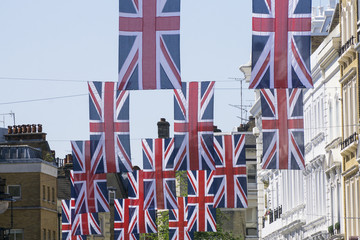 Fototapeta na wymiar Union Jack flags hang in Central London in preperation for the royal wedding