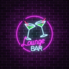 Neon cocktails lounge bar sign on dark brick wall background. Glowing gas advertising with glasses of alcohol shake.