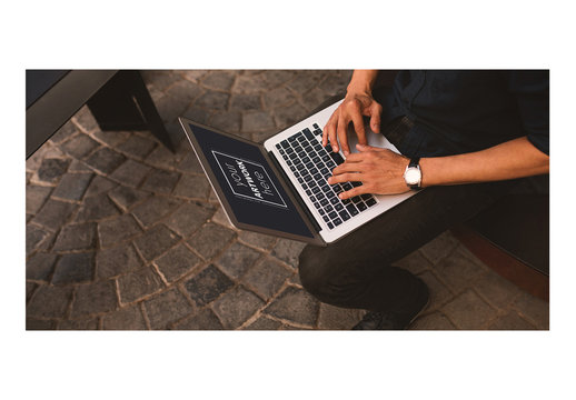 Laptop User with Cobblestone Floor Mockup