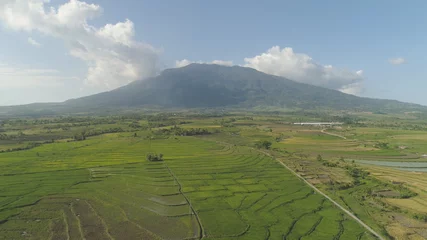 Fototapete Luftbild Mountain valley with farmland, rice terraces near mount Isarog. Aerial view mount with green tropical rainforest, trees, jungle with sky. Philippines, Luzon. Tropical landscape