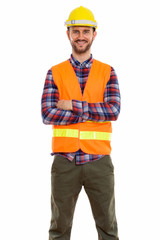 Young handsome bearded man construction worker