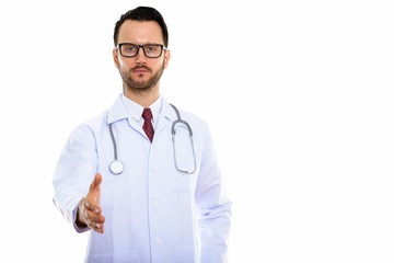 Fototapeta premium Young handsome bearded man doctor