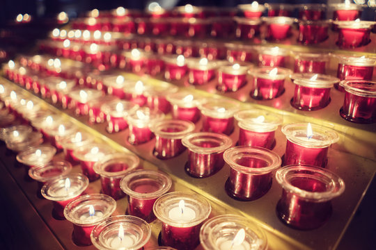 Memorial candles in church - Powered by Adobe