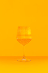 a glass of a sparkling drink with a summer sky 