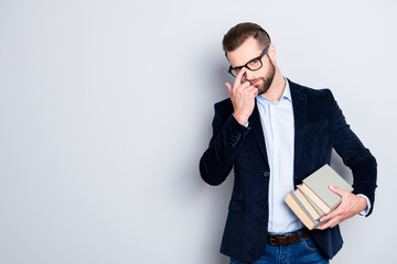 Portrait with copyspace, empty place of attractive stylish teacher fixing his glasses on face with...