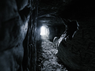 ansient dark stone cave whith letters inside view