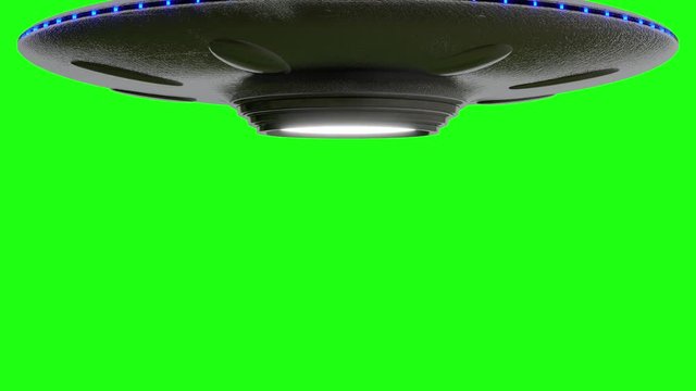 UFO Flying Saucer on Green screen rotates down from top of screen. Stops then rotates fly's up to top of greenscreen, loop 4k