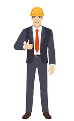 Businesswoman in construction helmet shows thumb up