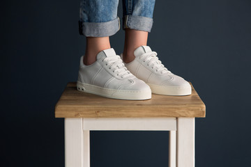 Girl in white fashionable sneakers