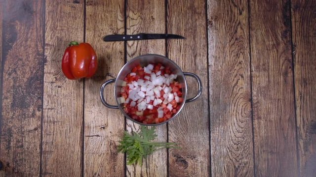 Cooking red soup. Quick recipe.Top view on food ingredients. Stop motion animation flick of a woman’s fingers. 05
