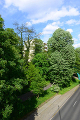 Fototapeta na wymiar Beautiful street landscape with trees and bridge in Monchengladbach, Germany