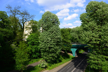 Beautiful street landscape with trees and bridge in Monchengladbach, Germany