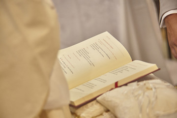 The gospel held up by the priest