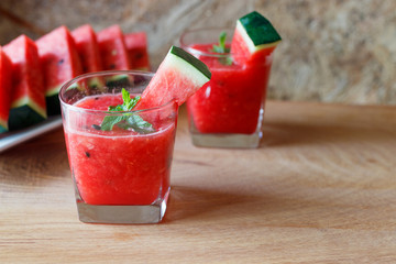 Watermelon drink on wooden background.