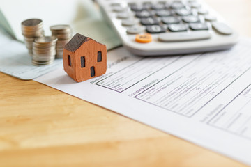 Home insurance form with money,passbook  and calculator.