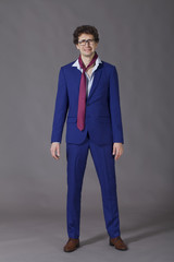 Young man wearing in blue suit standing and crying