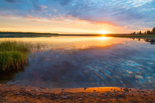 beautiful scenic lake at dawn, photo in orange color