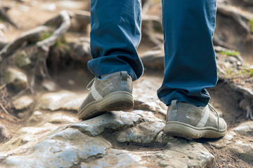 close-up of female foot of a tourist on stones