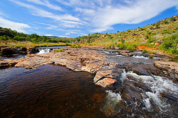 Fototapeta na wymiar Rapids at Bourke's Luck Potholes geological formation in the Blyde River Canyon area, Mpumalanga district, South Africa