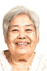 Happy smiling senior woman portrait. Dramatic look. Old chinese woman.
