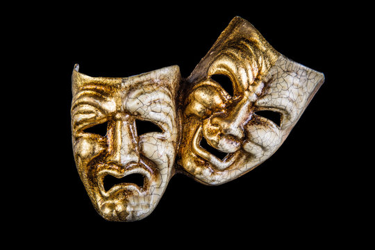 theatrical mask smile and sadness on a black background