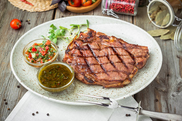 Tenderloin steak on plate with sauce